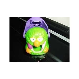   Witch Halloween Toy Green Monster Under Witch Face. Candy Dispenser