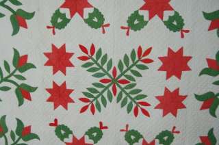 This OUTSTANDING cotton 1860s red & green applique quilt is hand 