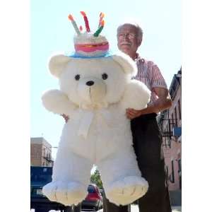   BIG PLUSH BEAR WEARING HAT THAT LOOKS LIKE A BIRTHDAY CAKE: Toys