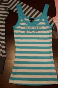   of 4 Bebe Sport Tops  2 tanks, 2 long sleeve shirts  NWOT size  Small