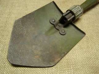 Vintage folding US Army field shovel with a date of 1945. There is a 